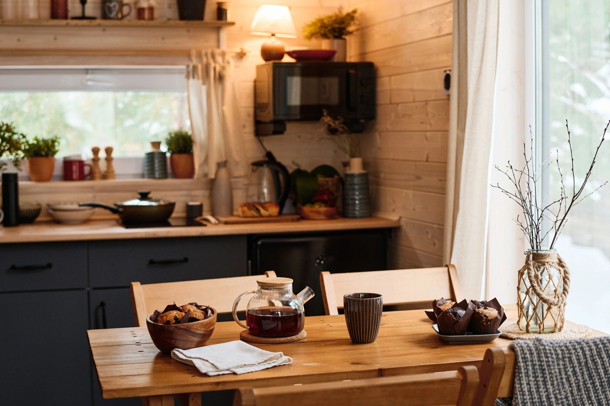 Warm wooden tiny home kitchen interior